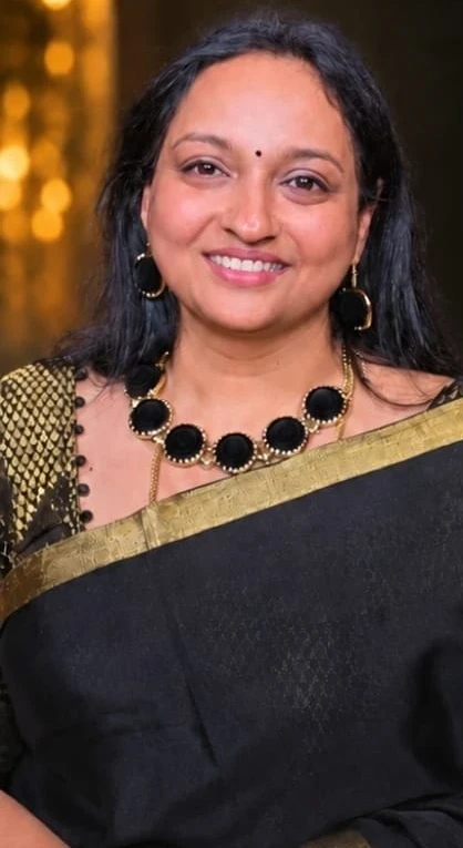 Dr Lavanya in a black silk saree with a gold border
